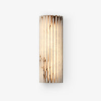 Alcaro alabaster wall light with a fluted white stone face on a plain white background