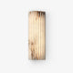 Alcaro alabaster wall light with a fluted white stone face on a plain white background