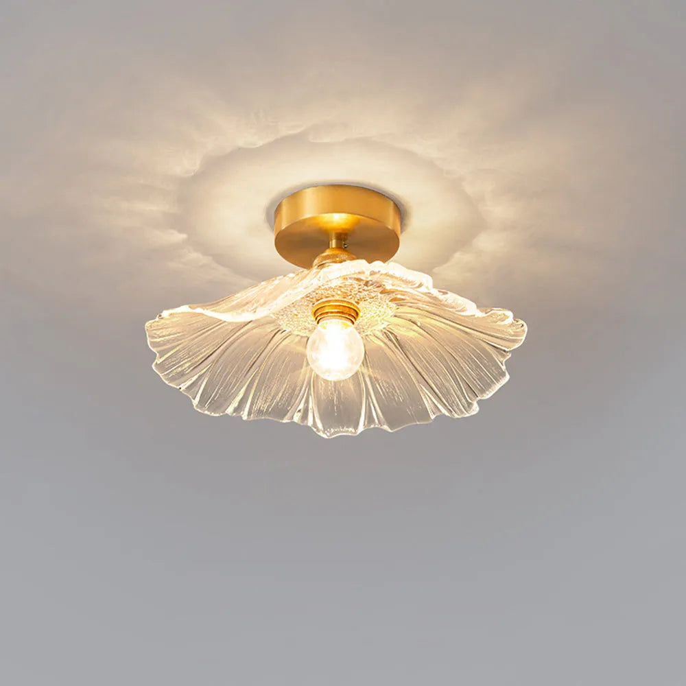 Calo flush mount ceiling light casting a petal pattern of light across the ceiling