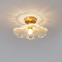 Calo flush mount ceiling light casting a petal pattern of light across the ceiling