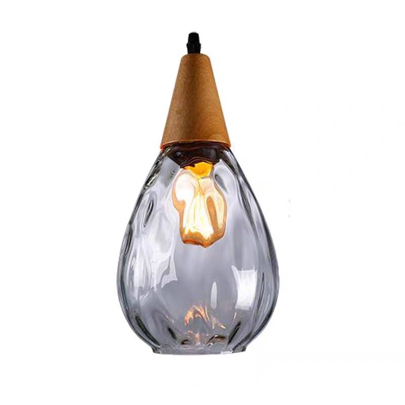 Drova clear glass pendant light on a white background showing the tapered cone top and rippled glass