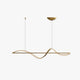 Kavro gold ribbon wave LED pendant light shown on a plain white background