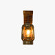 Kenva rustic lantern wall light with a bronze storm lantern on a pine bracket, shown on a plain background