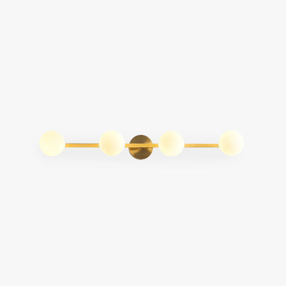 Sevra four globe vanity wall light in brass on a plain white background
