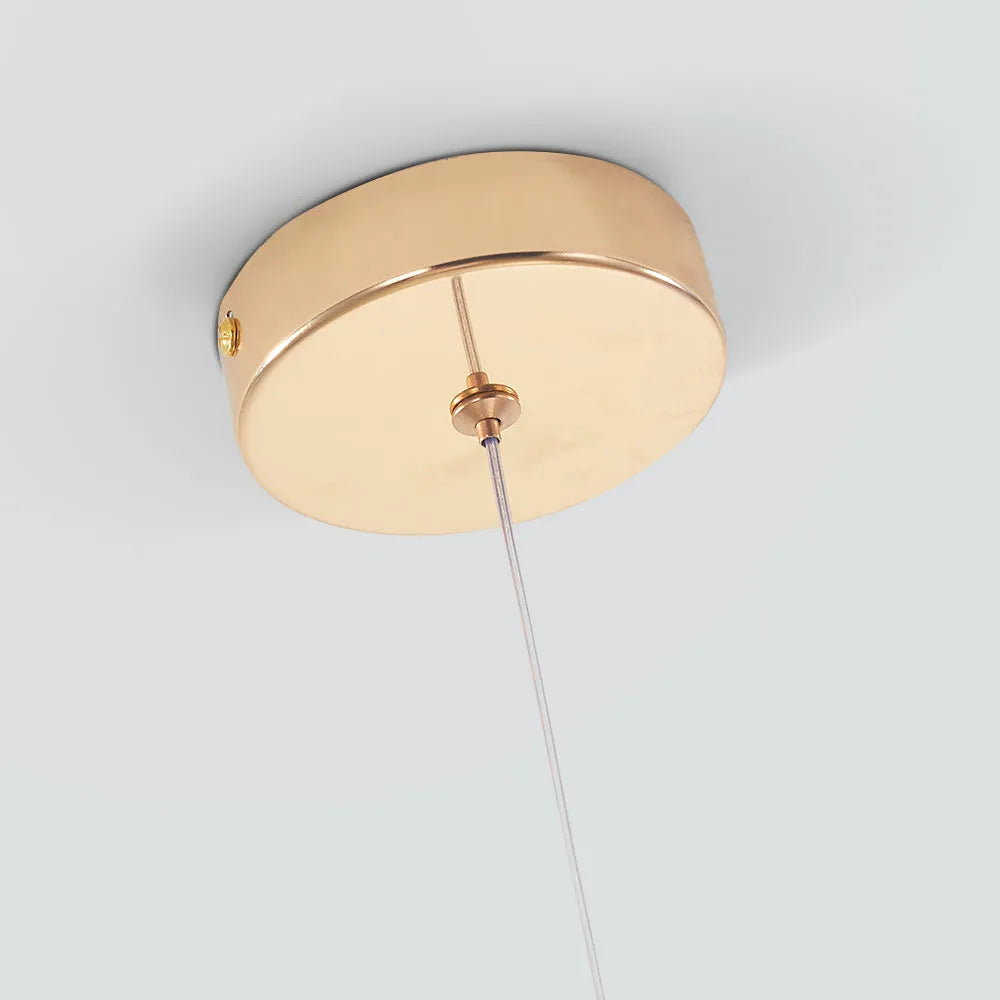 Gold ceiling canopy of the Golvara Teardrop Pendant Light with its adjustable suspension cord