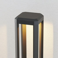 Close view of the Feryn head casting warm light down through the open aluminium frame