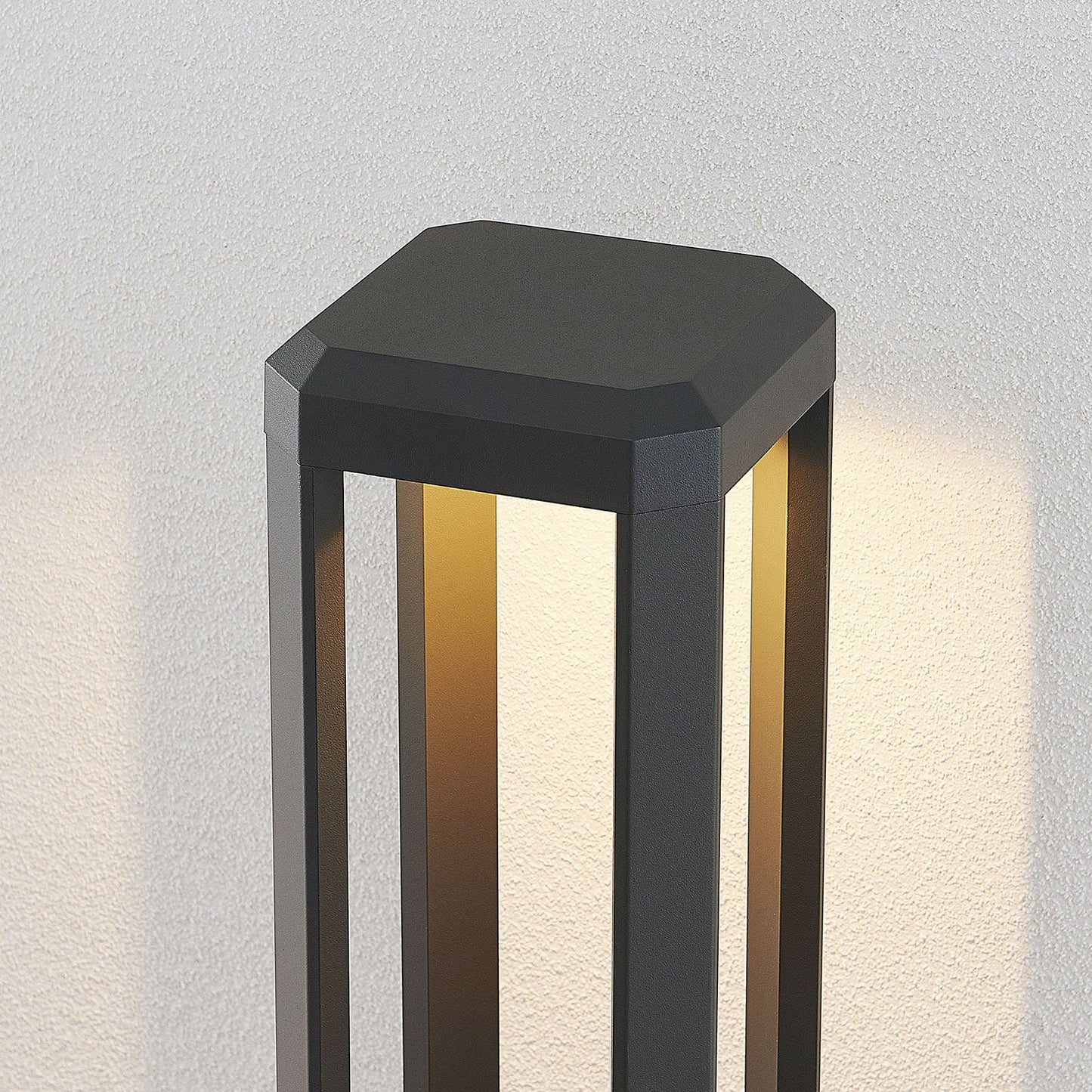 Close view of the Ryda chamfered cap and the lit inner faces of the anthracite frame
