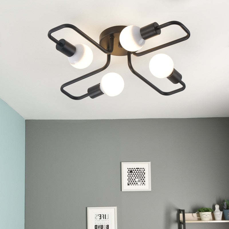 Indro flush mount ceiling light fitted to a white ceiling above a grey wall
