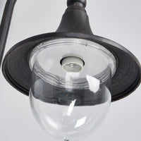 Close up under the Dafo outdoor wall light shade showing the clear domed diffuser and screw bulb holder