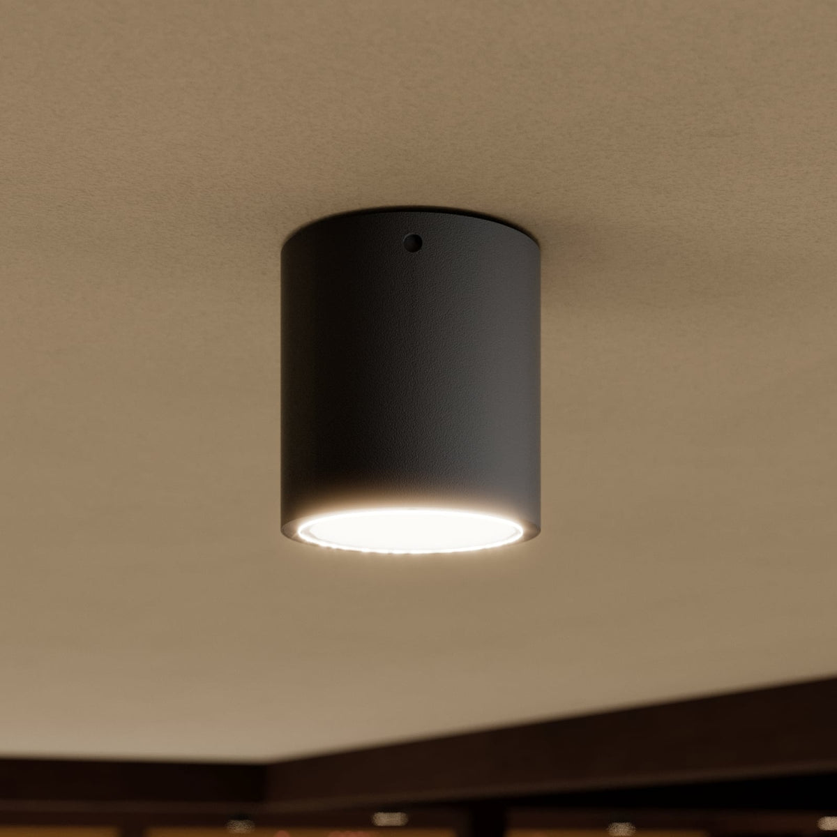 Mero Round Outdoor Ceiling Light glowing warm white on a porch ceiling