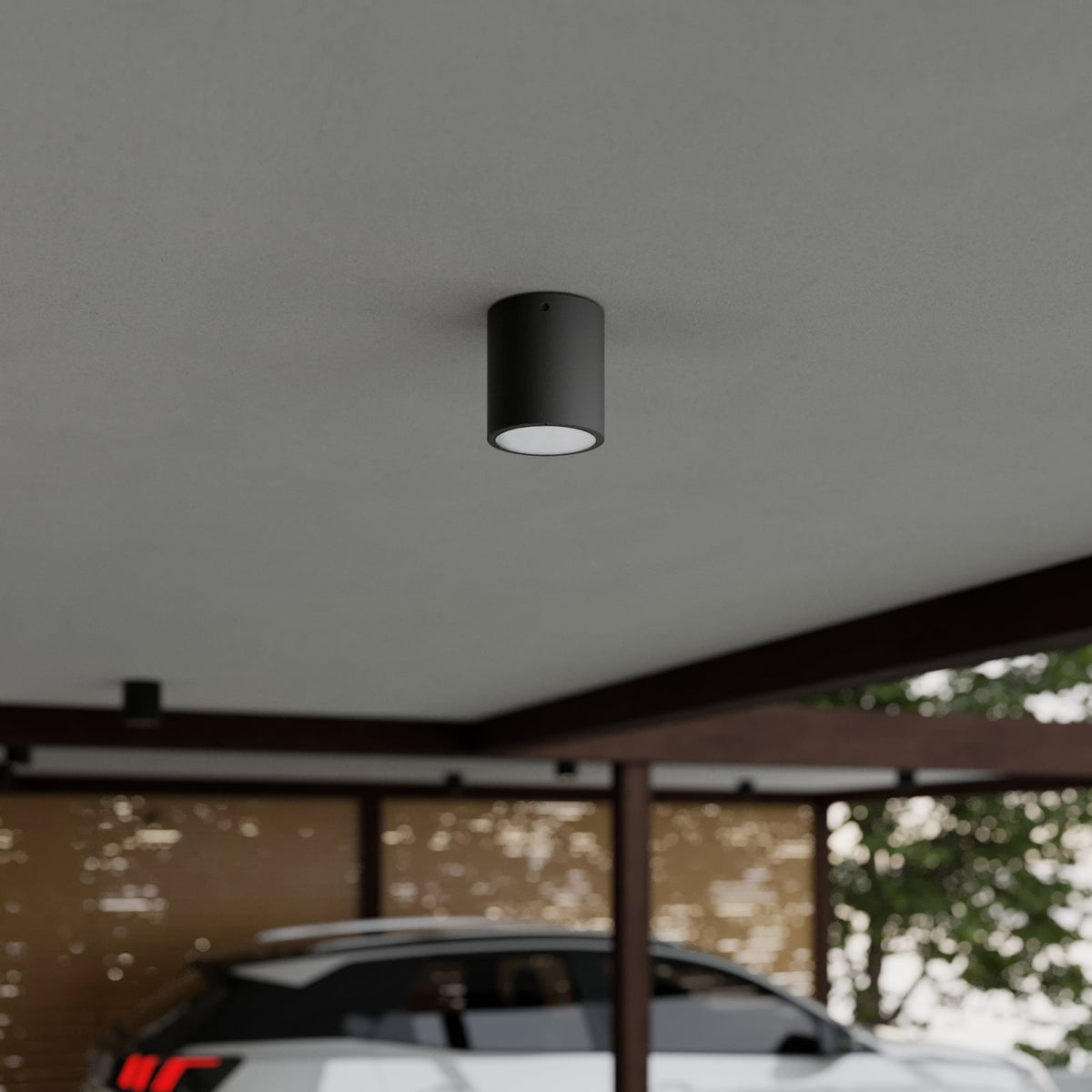 Mero Round Outdoor Ceiling Light mounted on a covered carport ceiling in daylight