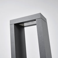 Close-up of the Jupo path post light head showing the recessed LED panel and glass cover set under the top bar