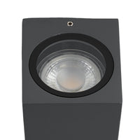 Close-up of the Xato wall light showing the GU10 lamp and glass cover