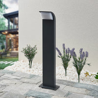 Tilo pedestal light on a paved path next to lavender and white gravel