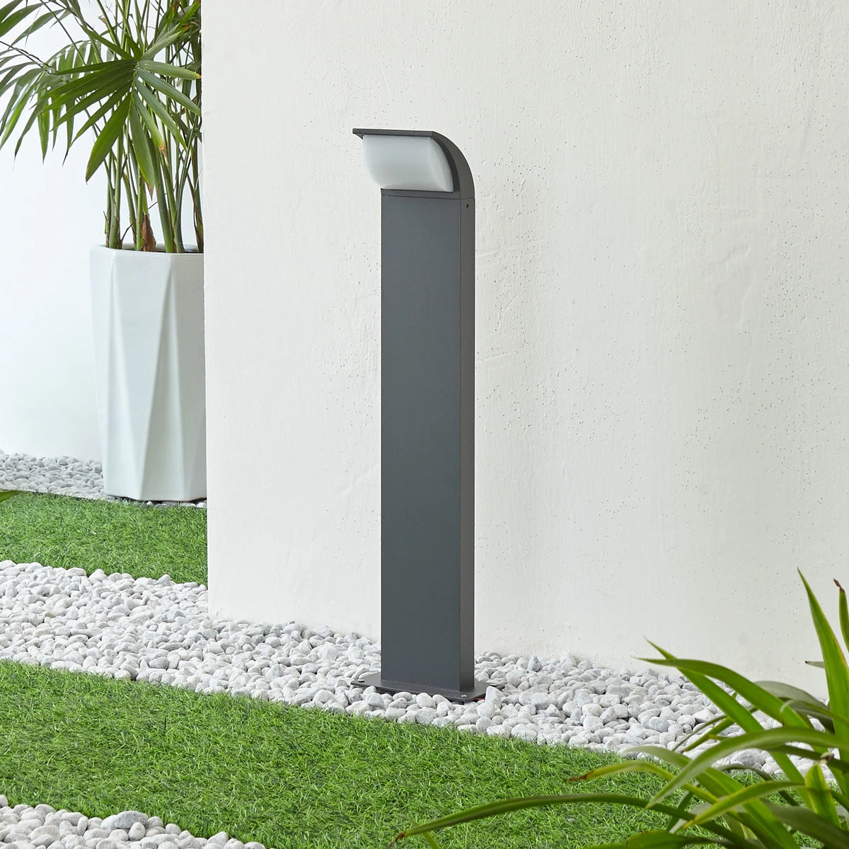 Tilo path light in daylight showing the slim anthracite post and base plate