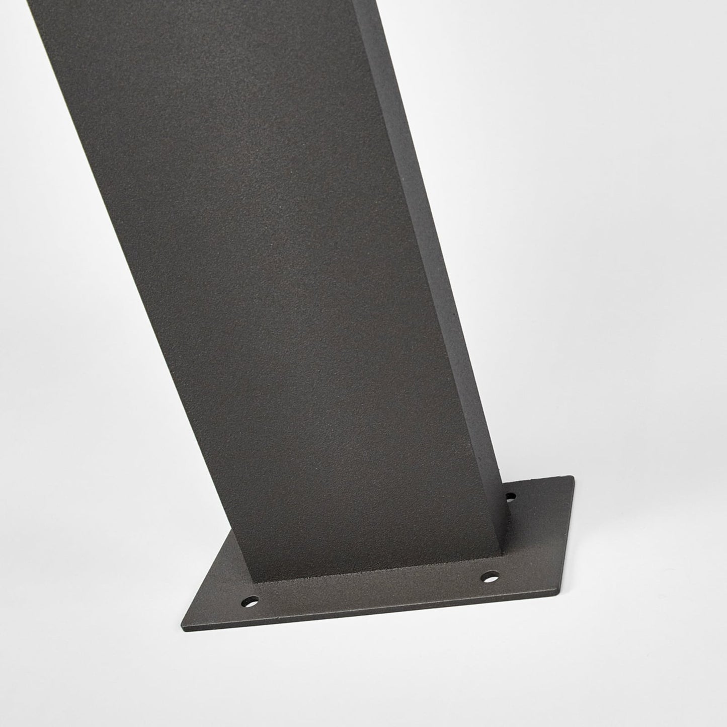 Detail of the Timo path post light base plate with fixing holes for bolting down to paving or decking