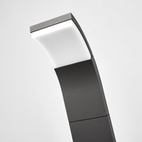 Close-up of the Timo path light tilted head with the white diffuser lit in warm white