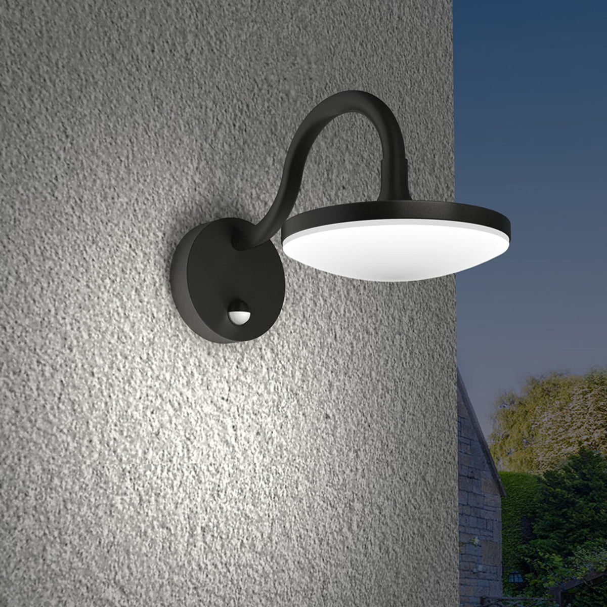 Angled view of the Finno wall light mounted on a rendered wall at dusk
