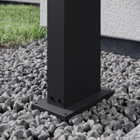 Close view of the bolt-down base plate of the Yola Path Post Light on gravel