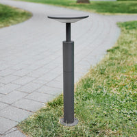 Feno anthracite path post light unlit in daylight at the edge of a paved walkway