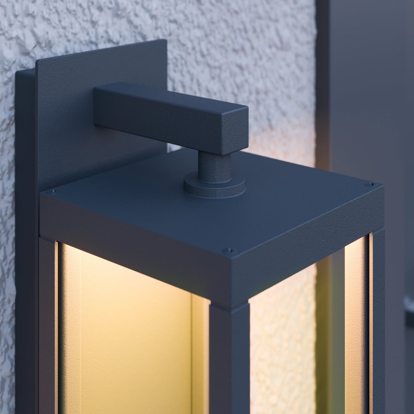 Close view of the Denro squared wall bracket and the top of the lit glass frame