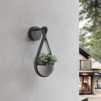Norva Stone Planter Outdoor Wall Light fitted to an exterior wall with a small plant in the bowl