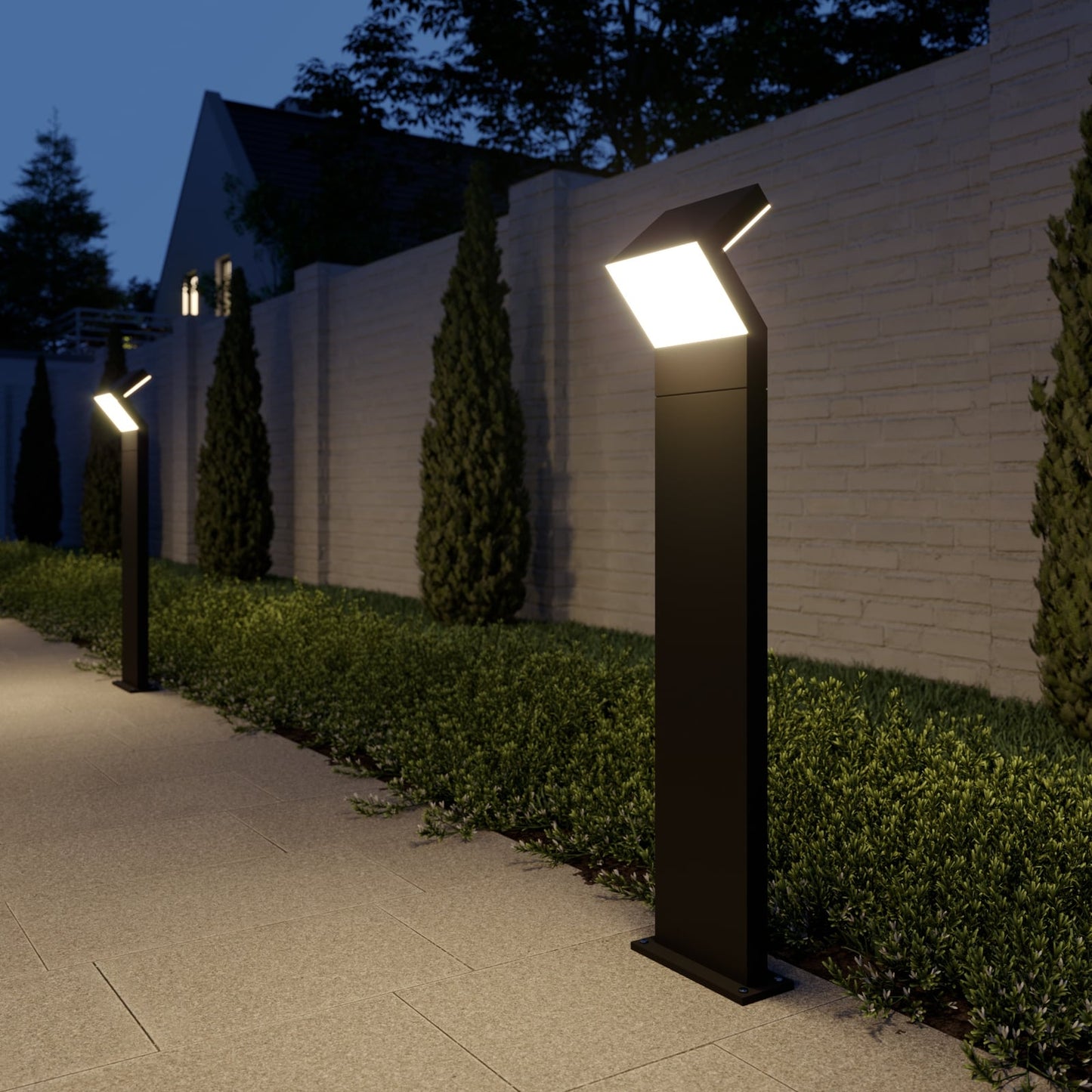 Two Havo Tall Path Lights spaced along a paved garden path at dusk