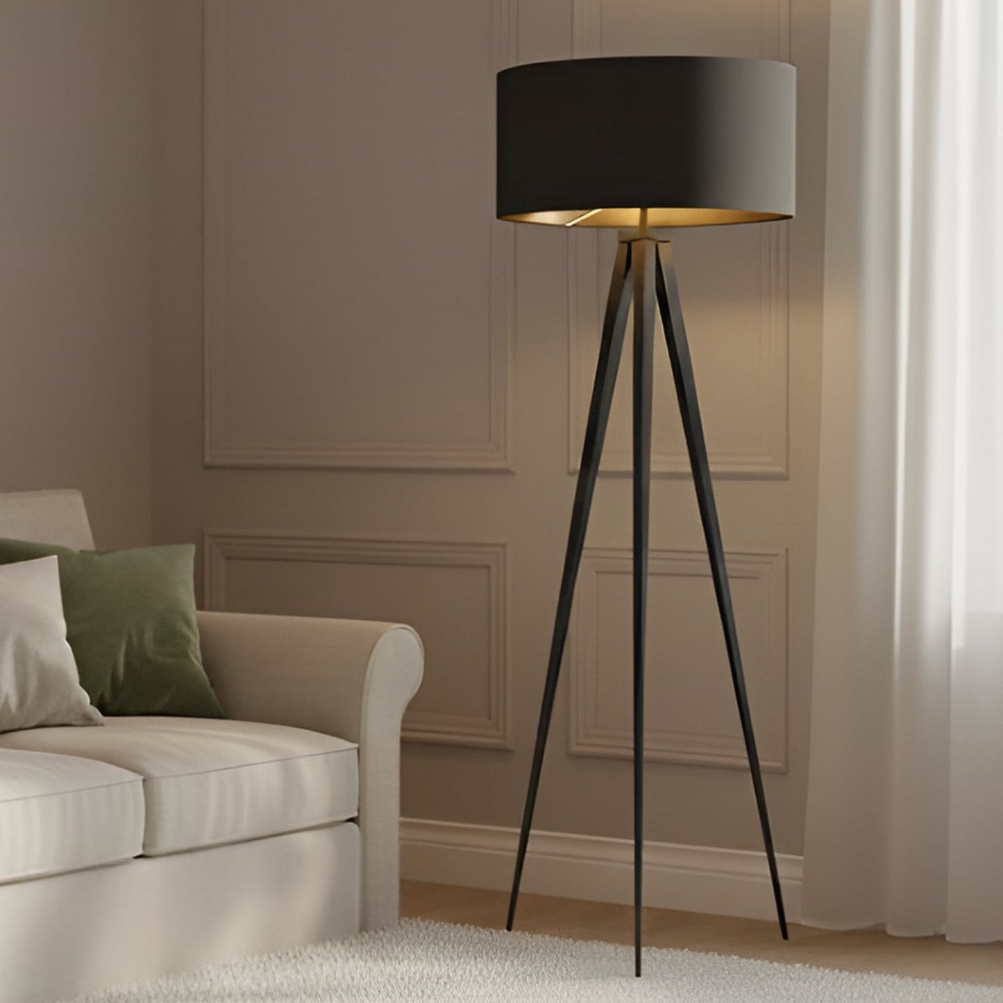 Beno tripod floor lamp lit beside a cream sofa in a panelled living room