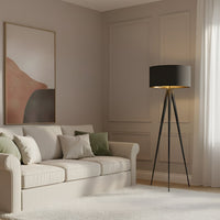 Beno floor lamp standing in the corner of a neutral living room next to a cream three-seater sofa
