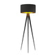 Beno tripod floor lamp on a white background, black drum shade with gold lining on three slim black tapered legs
