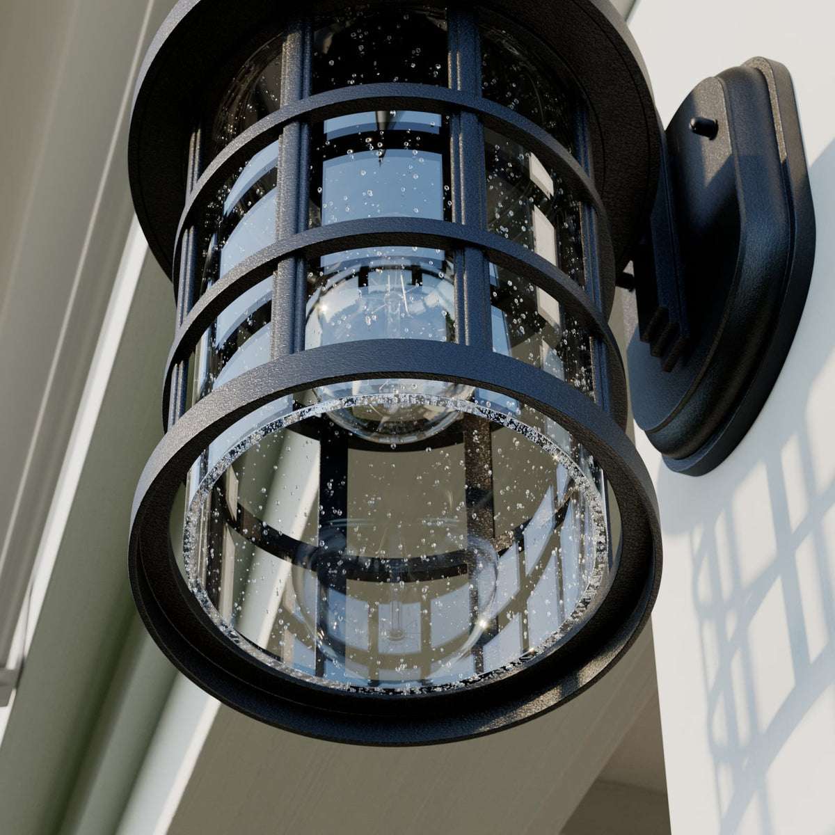 Close view from below of the Ankor lantern showing the bubbled glass cylinder and lower ring
