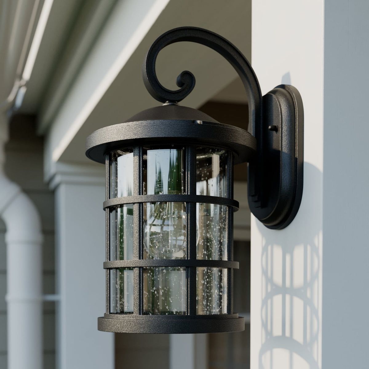 Side view of the Ankor lantern unlit against a sage green wall showing the strut cage detail