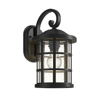 Ankor black outdoor wall lantern with scrolled arm and seeded glass shade on a plain white background