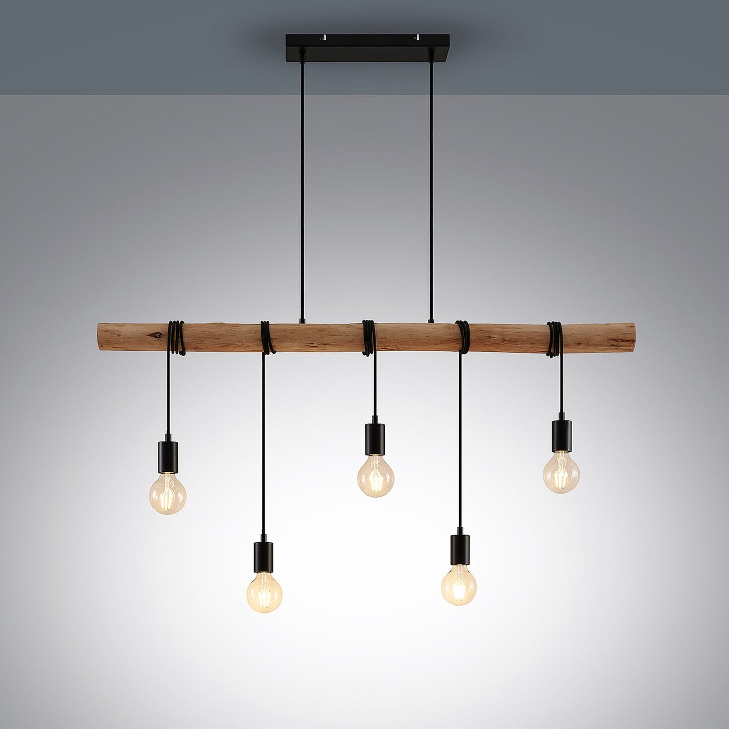 Rovo pendant light lit against a plain grey background showing the black ceiling canopy and five staggered bulb drops