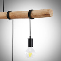 Close-up of the Rovo pendant light showing the black rope binding around the natural wood beam and a matt black lamp holder