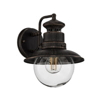 Erdo Rust Lantern Outdoor Wall Light on a plain white background showing the rust brown shade and clear glass globe