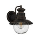 Erdo Rust Lantern Outdoor Wall Light on a plain white background showing the rust brown shade and clear glass globe