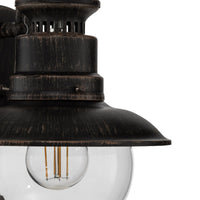 Close view of the flared rust brown shade on the Erdo Rust Lantern Outdoor Wall Light