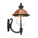 Koma copper outdoor wall lantern with black scrolled bracket and clear glass bowl, plain white background