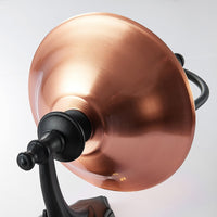 Close-up of the brushed copper roof of the Clivo outdoor wall light, showing the polished copper finish and black fitting