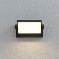 Shiro wall light lit at night showing the wide warm white light panel