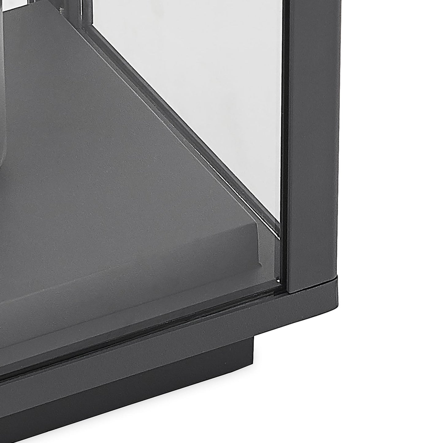 Close detail of the Giva pillar post light showing the glass pane seated in the anthracite aluminium frame above the stepped base
