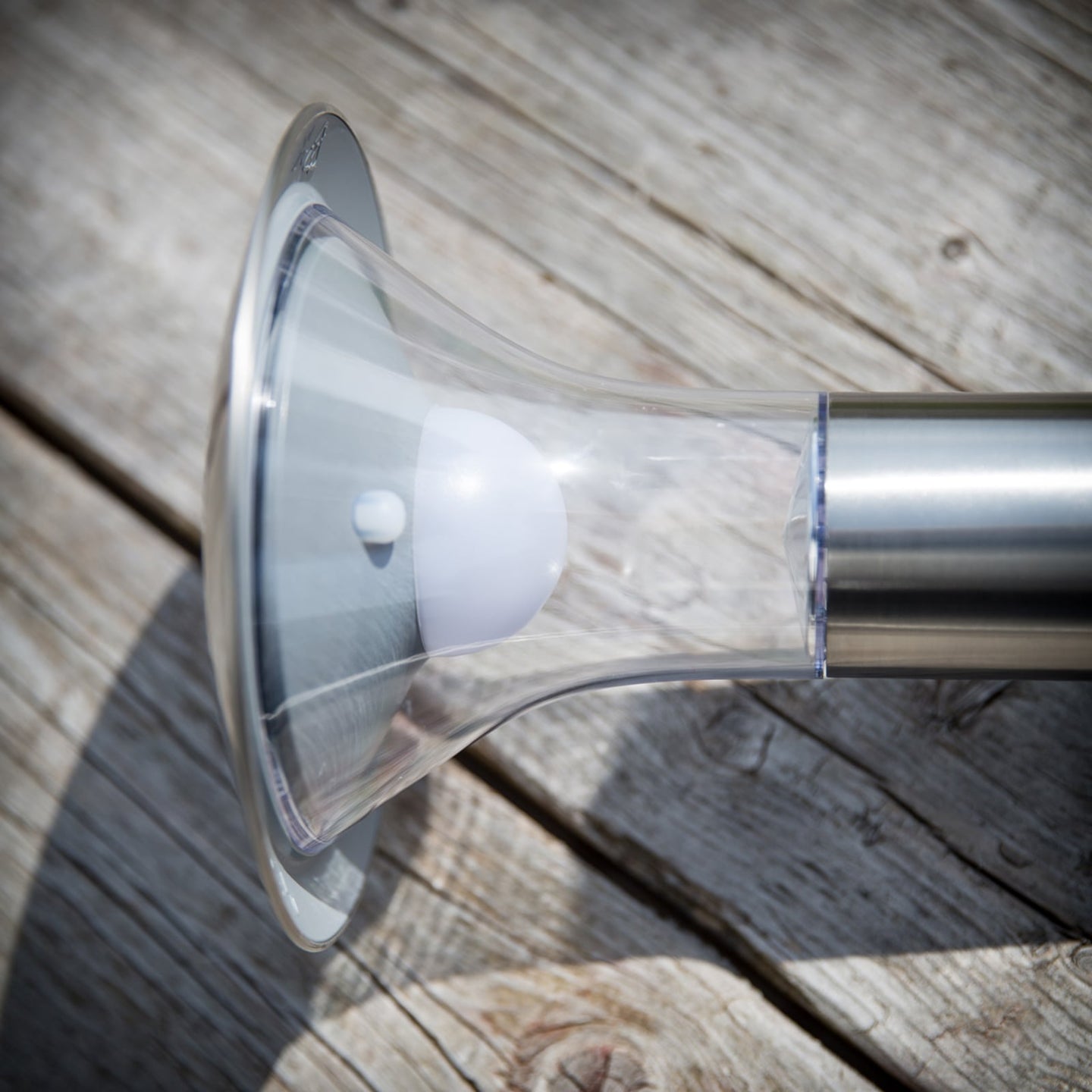 Detail of the Jolo solar spike light showing the integrated LED under the clear flared diffuser