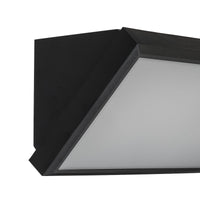 Close-up of the Abbo wall light angled edge showing the wedge shape and diffuser seal