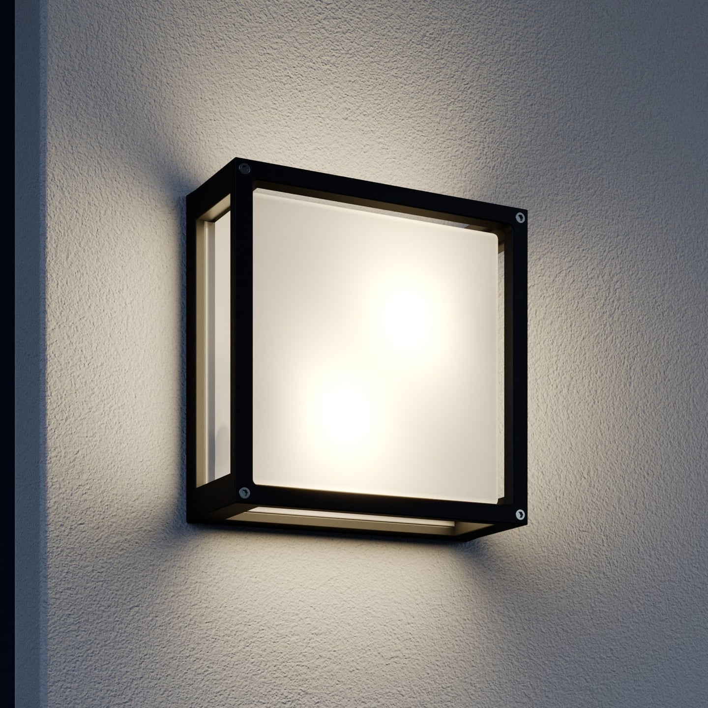 Auri square outdoor wall light switched on at night against a render wall, glowing evenly through the front and side glass panels
