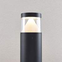 Close view of the Darjo Tall Bollard Light head showing the conical reflector behind clear glazing