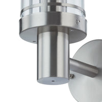 Close-up of the stainless steel collar and shade frame on the Davo wall light
