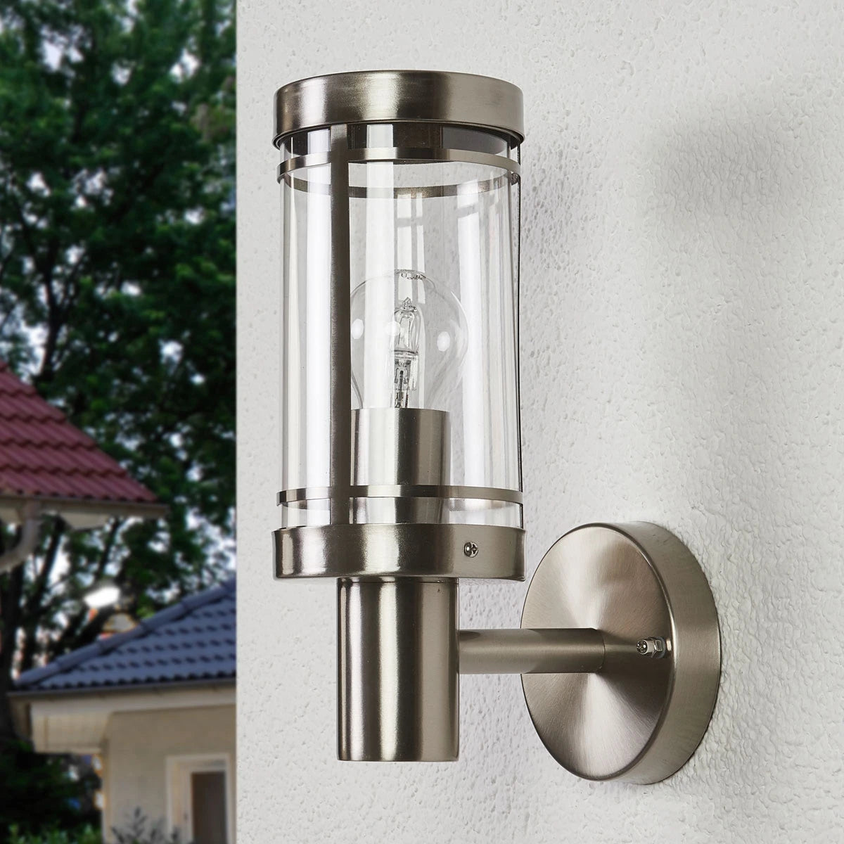 Davo stainless steel wall light mounted on a rendered exterior wall