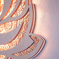 Lotus wall light above bed