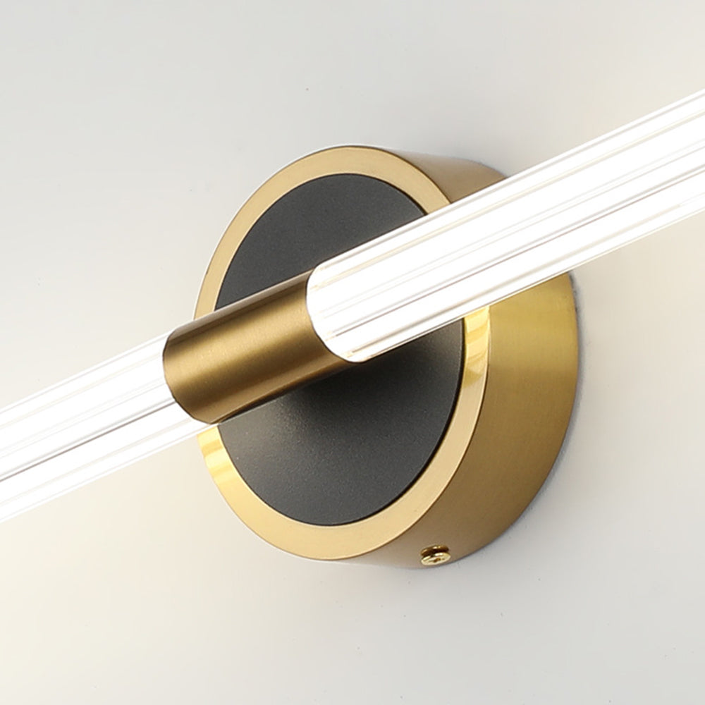 Close view of the brushed brass collar and matt black disc on the Miralo wall light